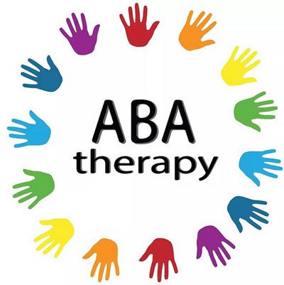 Sign that says ABA therapy with hands around it.