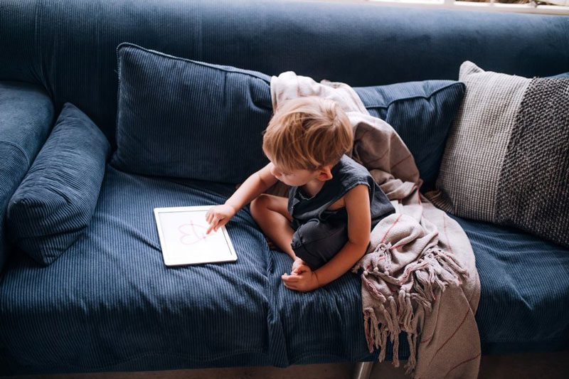 Child playing on the couch.