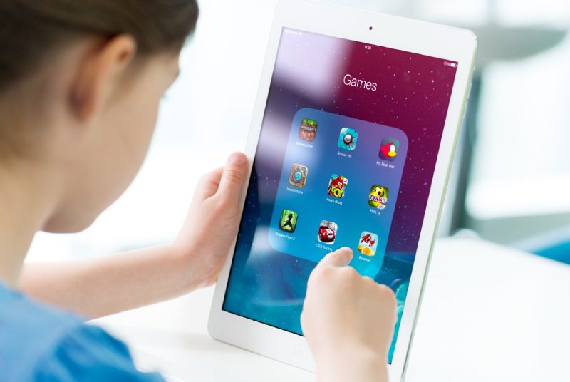 Children playing games on a tablet